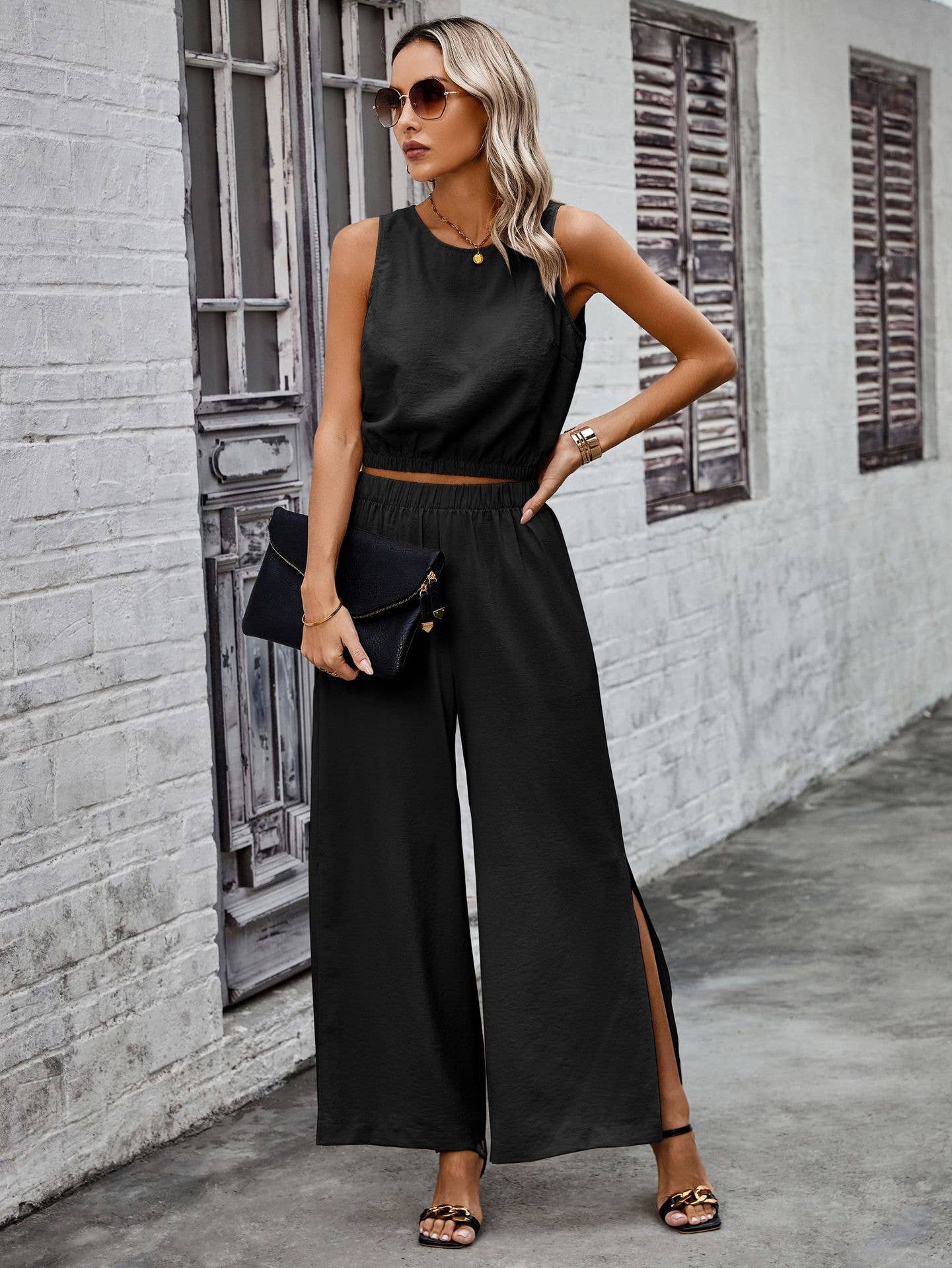 black set cropped top with waist band wide leg pants with slit 